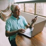 senior gent checking mobile phone