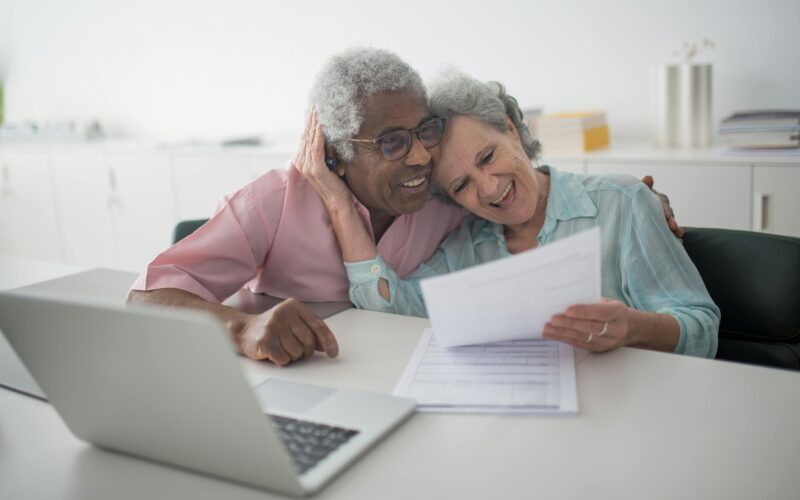 Interracial senior couple checking documents