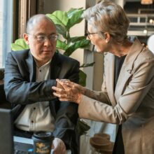 male and female seniors working at desk