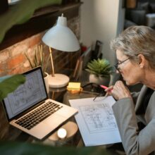 female senior working on laptop