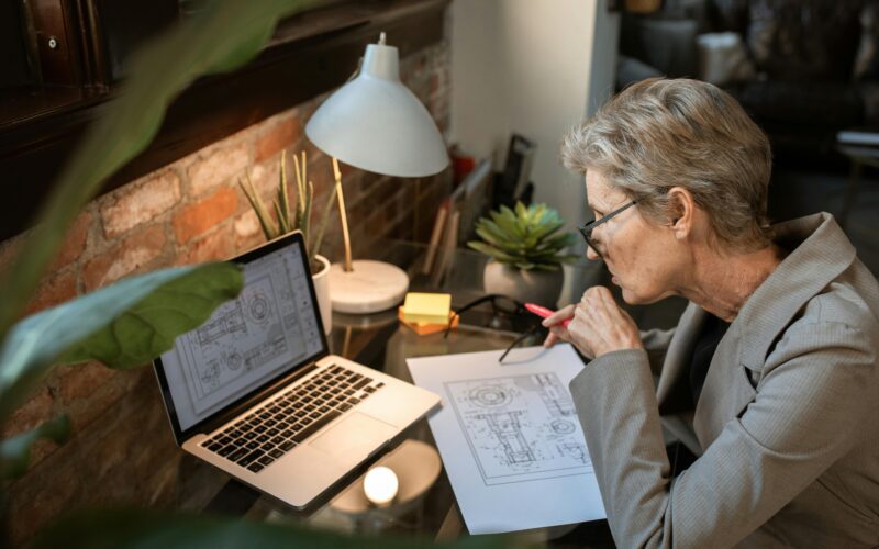 female senior working on laptop