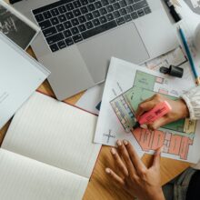 senior workin at busy desk