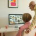 Two Seniors studying pc screen